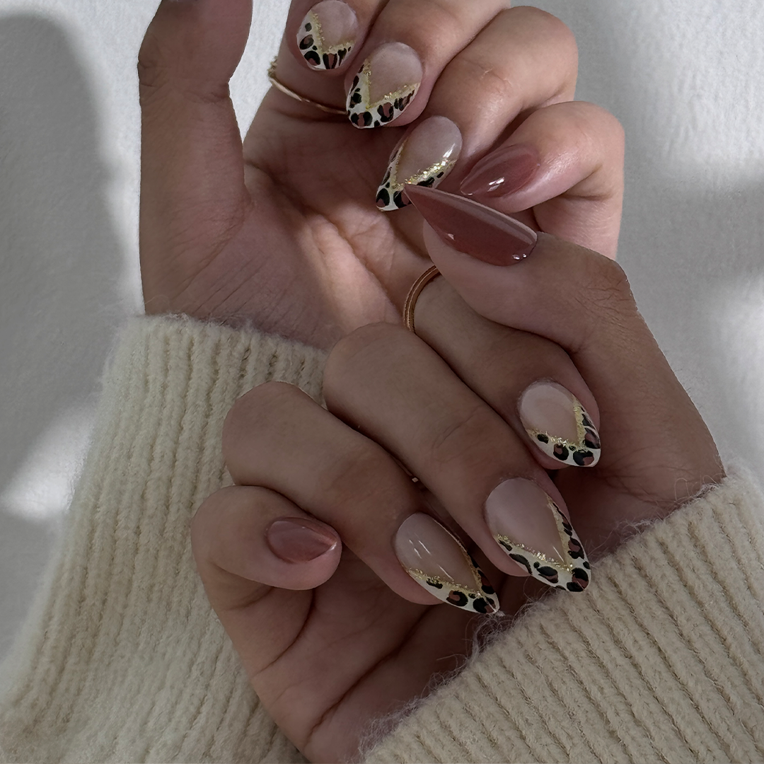 Fincloset chic brown and nude natural almond-shaped press-on nails with leopard print French tips, offering a classic, sophisticated, and trendy design for a versatile, everyday manicure.