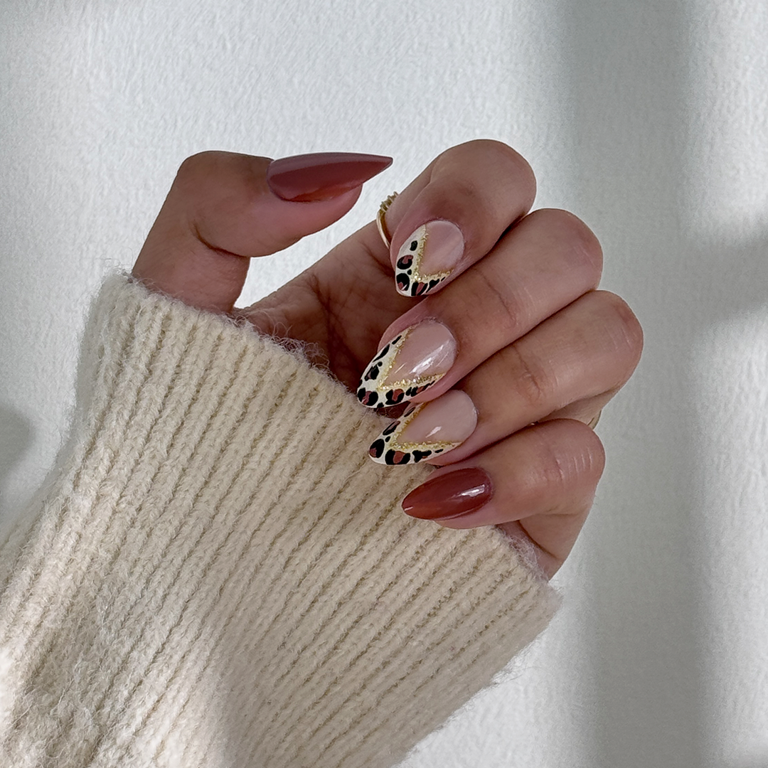 Fincloset chic brown and nude natural almond-shaped press-on nails with leopard print French tips, offering a classic, sophisticated, and trendy design for a versatile, everyday manicure.