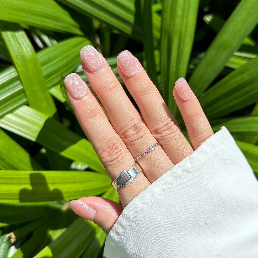 Handmade short glossy cat eye press-on nails in semi-transparent jelly pink, with a delicate cat-eye shimmer, Fincloset Casual Elegance collection