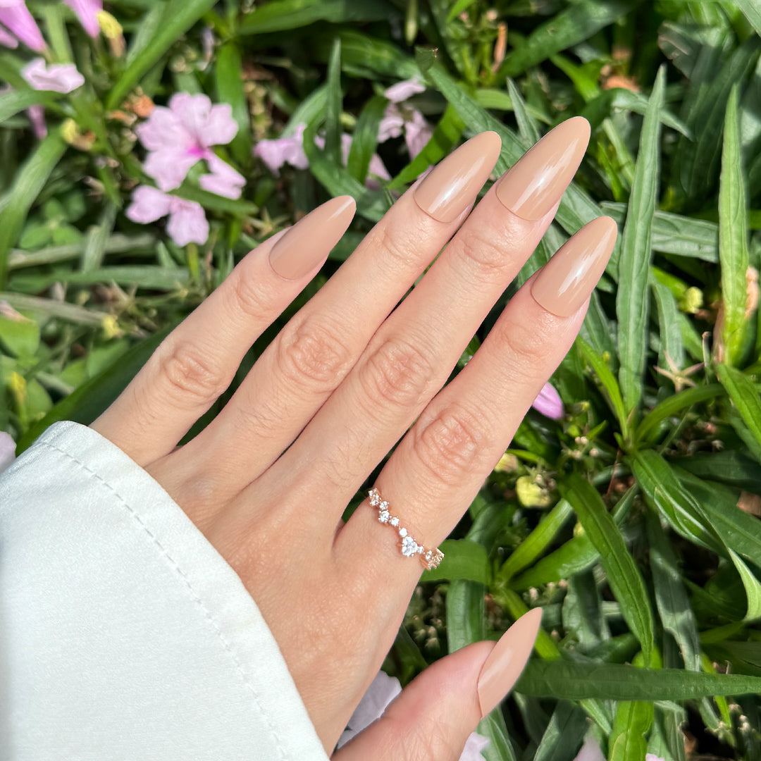 Glossy almond-shaped press-on nails in a rich brown tone, perfect for a versatile and stylish look.