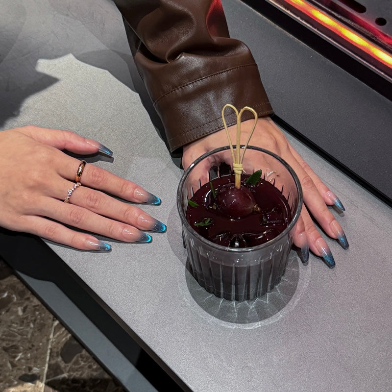 Handmade long coffin-shaped French press-on nails with blue gradient cat-eye effect and subtle sparkles, offering a minimalist and elegant style.