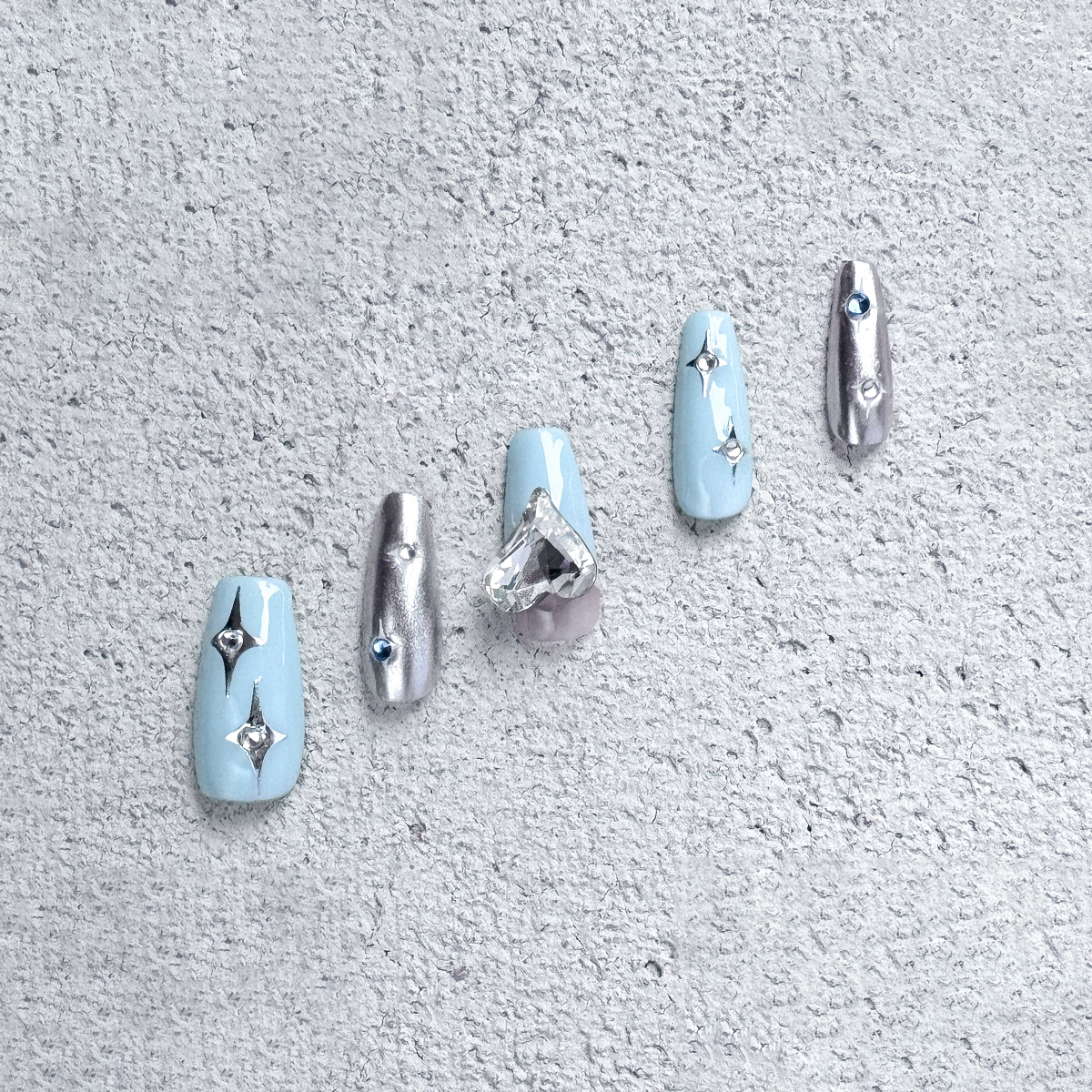Fincloset Blue Sparkle Handmade Coffin-Shaped Press-On Nails in Creamy Blue with Silver Accent, Star and Heart Gem Details for a Playful Look