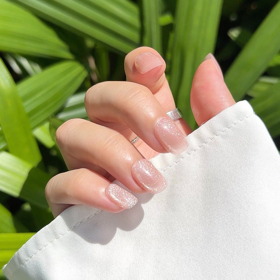 Handmade short glossy cat eye press-on nails in semi-transparent jelly pink, with a delicate cat-eye shimmer, Fincloset Casual Elegance collection